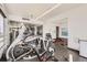 Community gym featuring an assortment of fitness equipment and large windows for natural light at 790 N Washington St # 804, Denver, CO 80203