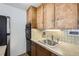 Kitchen with modern appliances, tile backsplash and wooden cabinets for a clean and modern look at 790 N Washington St # 804, Denver, CO 80203