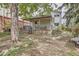 Backyard features a covered porch with a wooden fence at 7198 Eaton Ct, Arvada, CO 80003