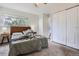 Bright bedroom featuring a large window, closet, and neutral color scheme at 7198 Eaton Ct, Arvada, CO 80003