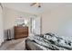 Bright bedroom featuring carpet flooring, closet, and dresser at 7198 Eaton Ct, Arvada, CO 80003