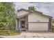 Charming two-story home with a front porch and an attached garage at 7198 Eaton Ct, Arvada, CO 80003