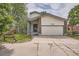 Charming two-story home with a front porch and an attached garage at 7198 Eaton Ct, Arvada, CO 80003
