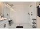 Bathroom showing glass enclosed shower with dual shower heads, white subway tile, and black hexagon floor tile at 6410 Silver Mesa Dr # B, Highlands Ranch, CO 80130