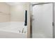 Bright bathroom featuring a soaking tub and a glass-enclosed shower at 1560 Milwaukee St # 240, Denver, CO 80206