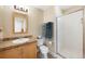 Bathroom featuring a vanity with granite counters, tile floor and a walk-in shower at 1560 Milwaukee St # 240, Denver, CO 80206