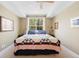 Cozy bedroom featuring a comfortable bed and a view of the trees at 1560 Milwaukee St # 240, Denver, CO 80206
