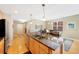 Kitchen with granite countertops and an island overlooking the dining area and living area at 1560 Milwaukee St # 240, Denver, CO 80206