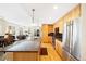 Bright kitchen with stainless appliances, granite island and open view to the living area at 1560 Milwaukee St # 240, Denver, CO 80206