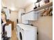 Efficient laundry room with a modern washer and dryer, and ample storage at 1560 Milwaukee St # 240, Denver, CO 80206