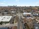 Aerial cityscape view featuring tree-lined streets and city skyline in the background at 361 S Logan St, Denver, CO 80209