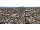 Aerial view of neighborhood with tree-lined streets and a glimpse of the city skyline at 361 S Logan St, Denver, CO 80209