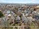 Aerial view showcasing a neighborhood with single-Gathering homes and mountain views in the distance at 361 S Logan St, Denver, CO 80209