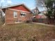 Backyard with brick home exterior and a wooden fence offers privacy and curb appeal at 361 S Logan St, Denver, CO 80209