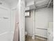 Bathroom featuring a stand-up shower, updated vanity, exposed duct work, and exposed brick painted white at 361 S Logan St, Denver, CO 80209