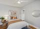 Cozy bedroom featuring a ceiling fan, neutral decor, and warm colors on the bedspread at 361 S Logan St, Denver, CO 80209