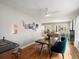 Open dining area with hardwood floors, a stylish table, and access to the kitchen at 361 S Logan St, Denver, CO 80209