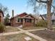 Charming brick home with a cozy front porch and well-maintained yard at 361 S Logan St, Denver, CO 80209