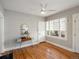 Bright room with beautiful hardwood floors, fan, and natural light from large windows at 361 S Logan St, Denver, CO 80209