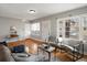 Comfortable living room with hardwood floors and abundant natural light from windows at 361 S Logan St, Denver, CO 80209