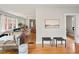 Open-concept living space featuring hardwood floors, modern decor, and a seamless flow to the dining area at 361 S Logan St, Denver, CO 80209