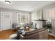 Cozy living room with hardwood floors, a fireplace, and comfortable seating at 361 S Logan St, Denver, CO 80209