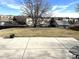 Large backyard with grassy area and concrete patio at 363 Helena Cir, Lone Tree, CO 80124