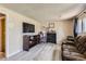 Finished basement area with comfortable seating and entertainment center at 2155 S Lewiston St, Aurora, CO 80013