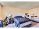 Comfortable bedroom featuring a cozy bed, neutral walls, and carpet flooring at 2155 S Lewiston St, Aurora, CO 80013