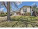 Charming split-level home featuring a well-maintained lawn and mature tree at 2155 S Lewiston St, Aurora, CO 80013