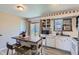 Functional kitchen featuring ample counter space, white cabinetry, and natural light at 2155 S Lewiston St, Aurora, CO 80013