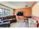 Cozy living room with neutral walls, light floors, and comfortable seating at 2155 S Lewiston St, Aurora, CO 80013