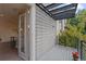 Charming balcony with gray decking and a modern railing, offering an inviting outdoor space; interior view through glass doors at 1325 Jackson St, Denver, CO 80206
