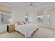 Bright bedroom featuring neutral decor, large windows, and a comfortable bed at 1325 Jackson St, Denver, CO 80206
