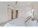 Serene bedroom with sliding closet door and an ensuite bathroom at 1325 Jackson St, Denver, CO 80206