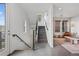 Inviting entryway with staircase, hardwood floors, and stylish decor leading to living area at 1325 Jackson St, Denver, CO 80206