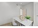Bright office featuring modern decor and a desk with a decorative plant; natural light filters through an open doorway at 1325 Jackson St, Denver, CO 80206