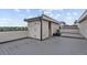 Spacious roof deck featuring gray decking, modern lighting, and a skyline view; perfect for outdoor entertaining at 1325 Jackson St, Denver, CO 80206