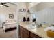 Clean bathroom with single sink vanity and a view into the bedroom at 8121 E 132Nd Ave, Thornton, CO 80602