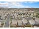 An aerial view of the community displaying numerous homes with well-manicured lawns and tree-lined streets at 1811 Hogan Ct, Castle Rock, CO 80109