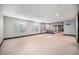 Spacious finished basement with recessed lighting, bar area, and neutral carpeting at 1811 Hogan Ct, Castle Rock, CO 80109