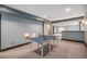 Finished basement with neutral carpeting, recessed lighting, and a ping pong table at 1811 Hogan Ct, Castle Rock, CO 80109