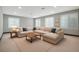 Spacious living room boasts plush sectional seating, recessed lighting, and bright, natural light at 1811 Hogan Ct, Castle Rock, CO 80109