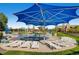 Community splash pad and lounge area with chairs for relaxation and Gathering fun at 1811 Hogan Ct, Castle Rock, CO 80109