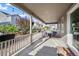 Covered back porch with string lights and outdoor seating, perfect for relaxation and entertainment at 22669 E Tufts Pl, Aurora, CO 80015