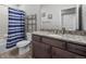 Bathroom with a granite countertop, a shower and tub, and a dark wood cabinet at 22669 E Tufts Pl, Aurora, CO 80015