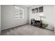 Bedroom showcasing a neutral color palette and a desk with a leafy green houseplant at 22669 E Tufts Pl, Aurora, CO 80015