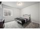 Bedroom featuring a simple decor, a window with blinds, and neutral-colored carpeting at 22669 E Tufts Pl, Aurora, CO 80015