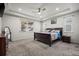 Spacious main bedroom with tray ceilings, carpet floors, recessed lighting, and two windows at 22669 E Tufts Pl, Aurora, CO 80015