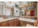 Unique bathroom boasts ornate design, a large mirror, a bathtub, and stone finishes at 829 Colorado Blvd, Idaho Springs, CO 80452